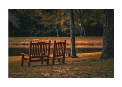 two chairs overlooking a lake